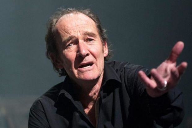 David Hayman performing on a one-man show called The Cause of Thunder and wearing a black longsleeve buttoned shirt.