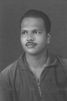 Dayananda Gunawardena in his youth wearing a polo shirt