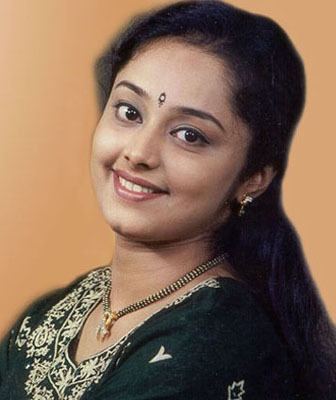 Deepa Nair wearing a black shirt, a necklace, and earrings