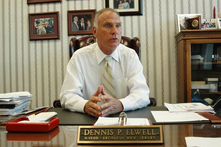 Dennis Elwell (politician) Former Secaucus Mayor Dennis Elwell is convicted of bribery in split