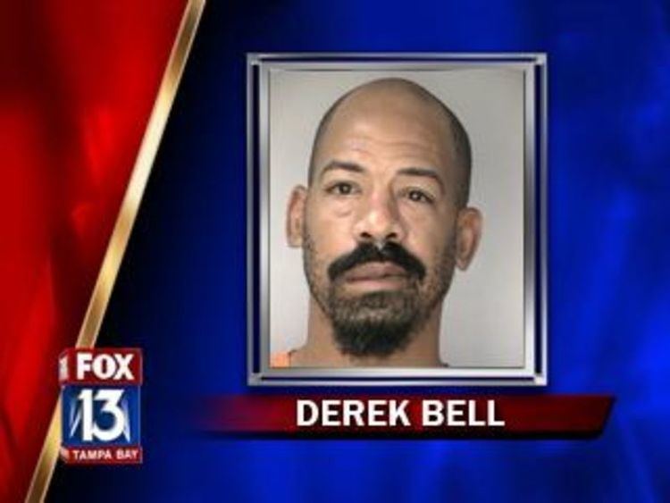 Derek Bell with mustache and beard, on a news report