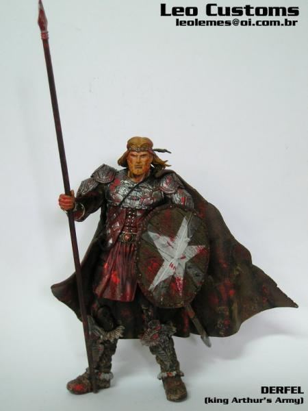 Derfel Cadarn's custom action figure, with long hair, holding a spear and shield, wearing a cape, and a warrior's armor.