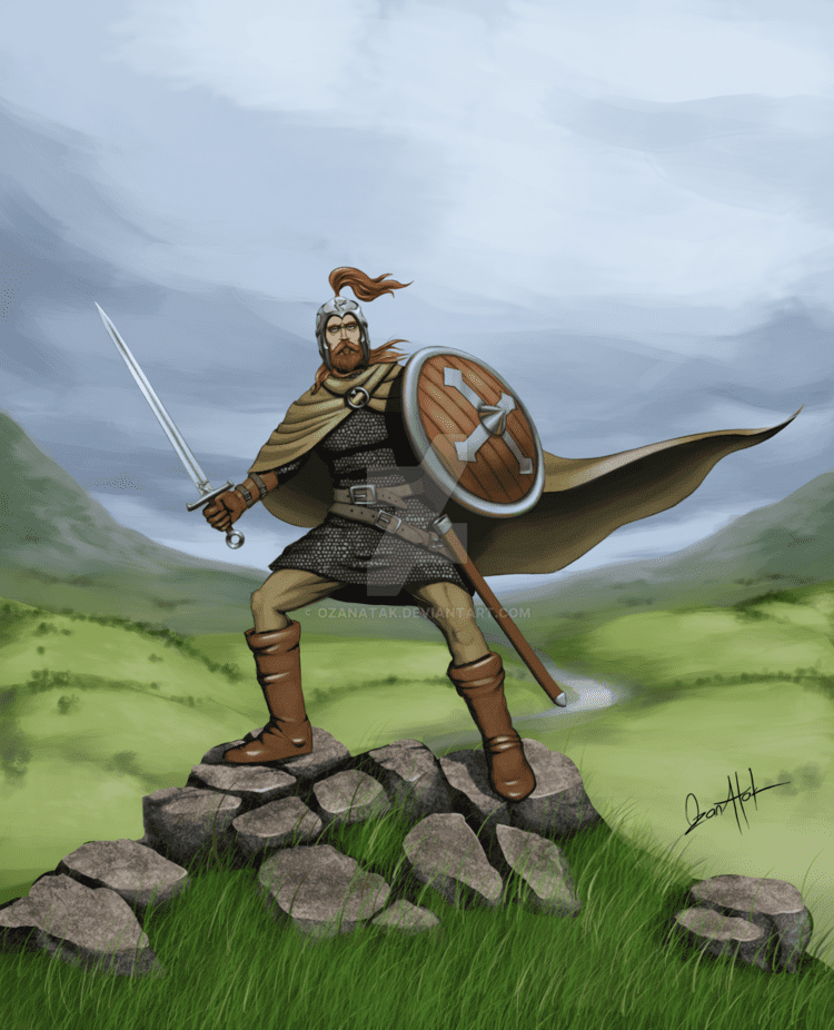 Derfel Cadarn with long hair, holding a sword and shield while standing on the top of a rock, wearing a cape, a warrior's armor, and brown boots.