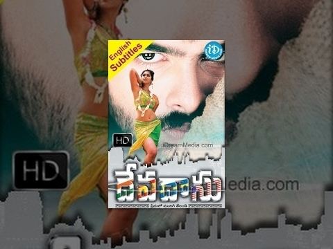 Ileana D'Cruz standing while wearing a yellow and green top and skirt and Ram Pothineni's face in the background in the movie poster of the 2006 Tollywood film, Devadasu