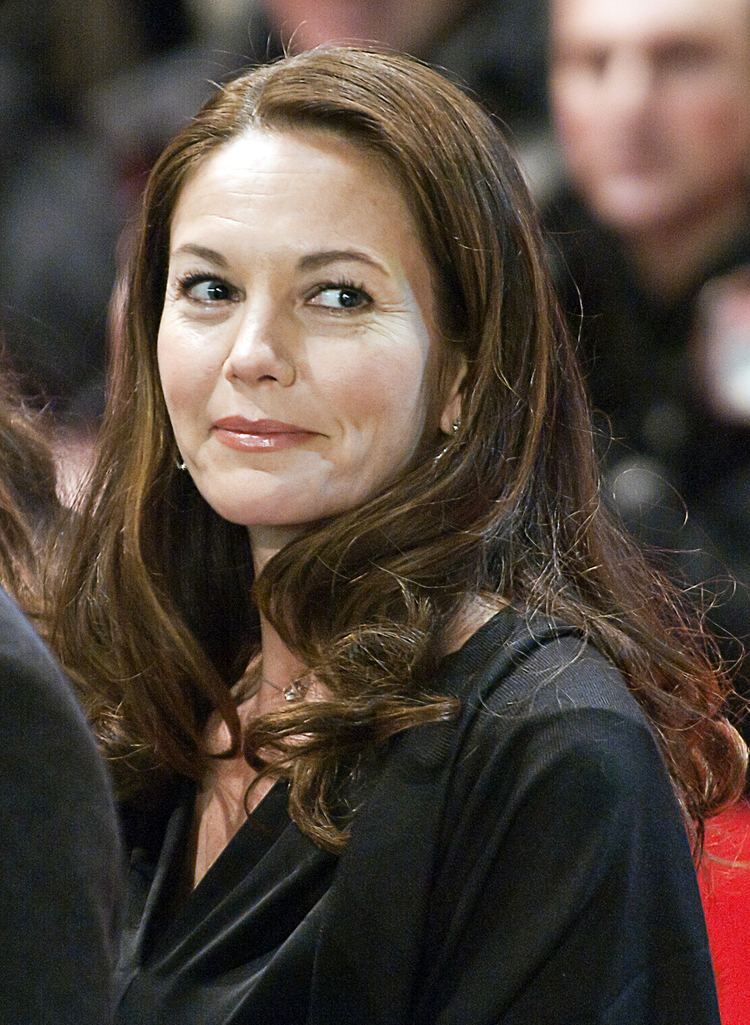 Diane Lane looking afar while wearing black blouse