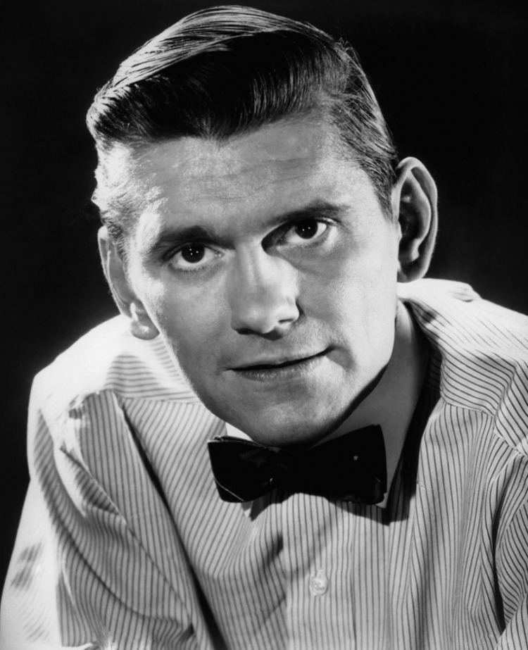 Dick York wearing a striped long-sleeve shirt and a bow tie