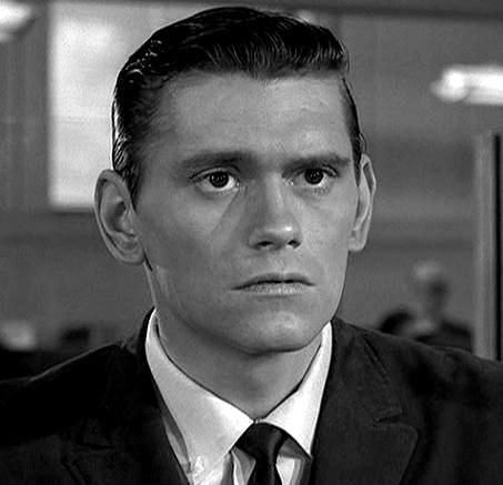 Dick York wearing a white shirt, a black suit, and a tie