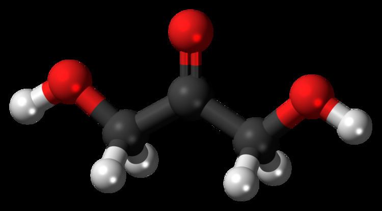 The structure of Dihydroxyacetone in a black background, with a 3D model of each element in three different color, Red, BLack and White.