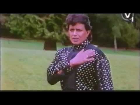 A scene from Diya Aur Toofan featuring Mithun Chakraborty as Amar wearing black polka dots long sleeves.