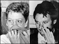 On the left, Dominique Prieur covering her mouth with cloth and wearing eyeglasses while on the right is Alain Mafart waving his hand