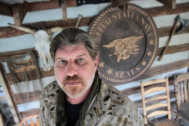 Don Shipley (Navy SEAL) wearing  a black shirt and a jacket