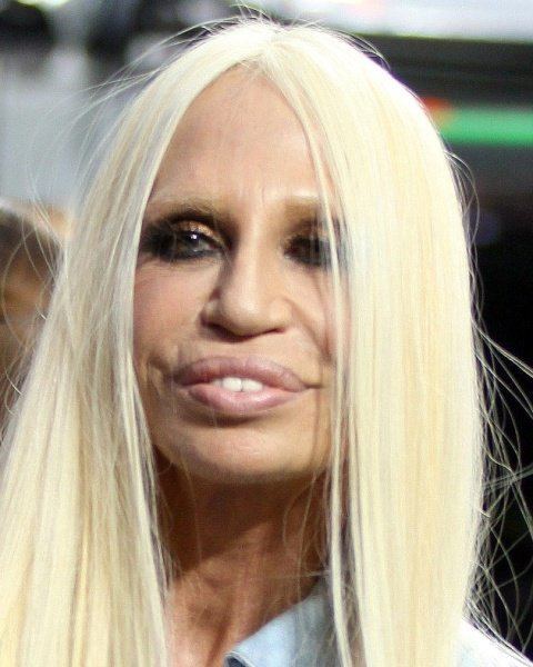 Donatella Versace smiling with a blonde hair