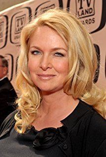 Donna Dixon smiling with wavy blonde hair in a black dress during the TV Land Awards 2010 at Sony Studios Culver City, California