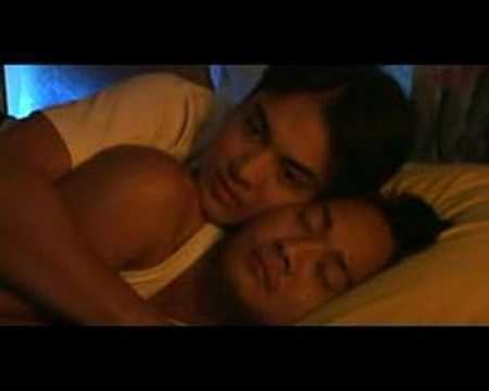 Andoy Ranay and Paulo Gabriel lying on a bed in a movie scene from Doubt (Duda), a 2003 Filipino film about fidelity and deception in a gay relationship.