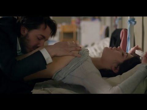 Guillaume Gallienne holding Adèle Exarchopoulos' breast and kissing her belly in a movie scene from Down by Love (2016 drama film)