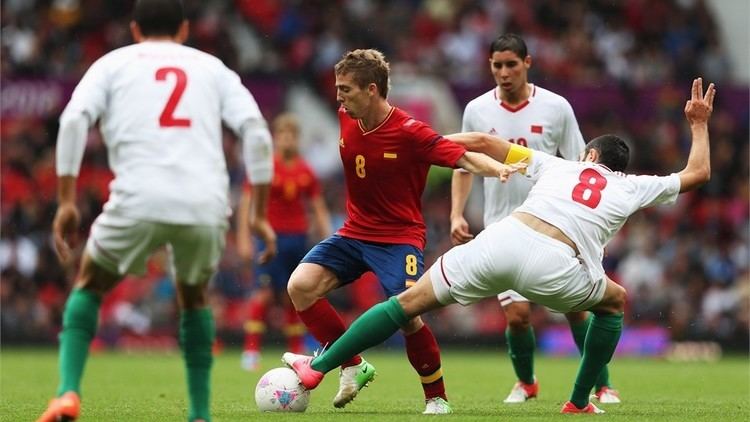 Driss Fettouhi Iker Muniain C of Spain and Driss Fettouhi of Marocco compete