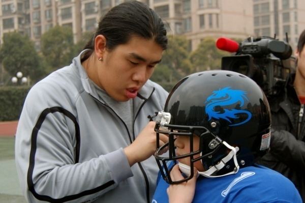 Ed Wang PHOTOS NFL39s Ed Wang Running Football Practice in