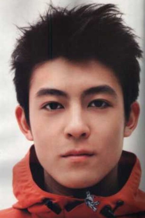 Edison Chen looking serious in an orange jacket