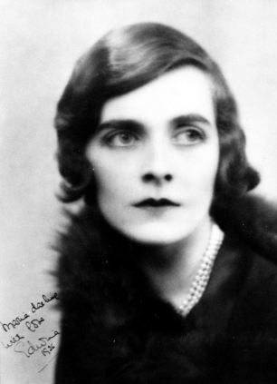 Edwina Mountbatten, Countess Mountbatten of Burma, looking afar while wearing a black blouse and pearl necklace