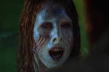 Julia Rose with pointed teeth and gills as she play the role of the Eel girl in the 2008 film "Eel Girl"