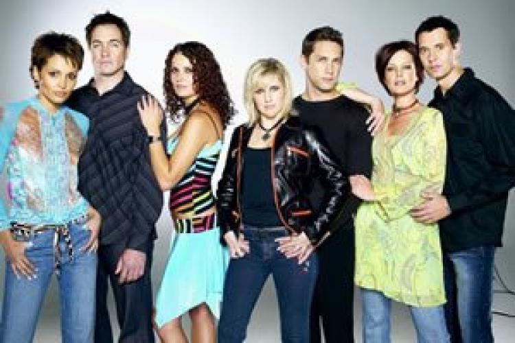 Michelle Beling, at the center, together with the other cast of the 1992 South African soap opera, Egoli: Place of Gold