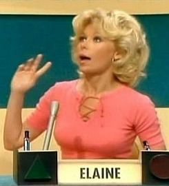 Elaine Joyce at the Match Game Comedy's game show while wearing a peach blouse