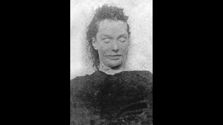 Elizabeth Stride lying on the coffin and wearing a black blouse
