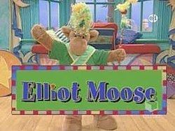 Elliot Moose from the TV series with a brown skin tone wearing a yellow hat and green shirt with a green scarf.