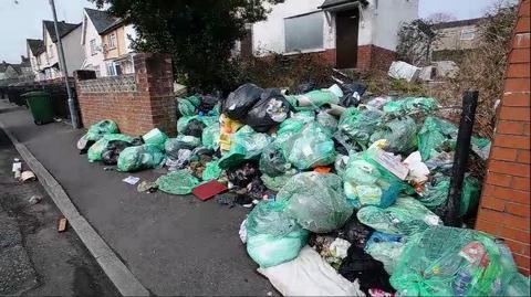 Ely, Cardiff Homeowners warned after huge piles of rubbish spill out onto the