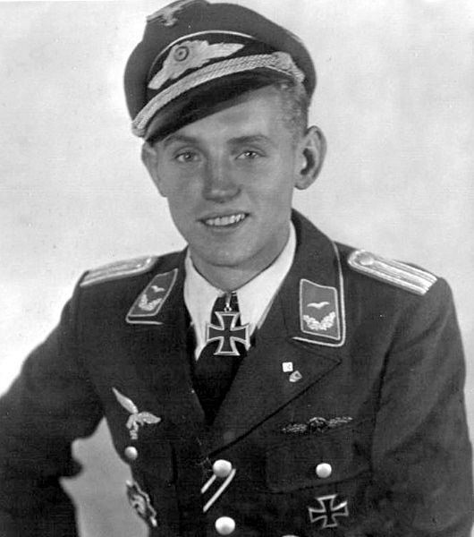 Erich Hartmann smiling while wearing an Air Force service dress uniform and peaked cap