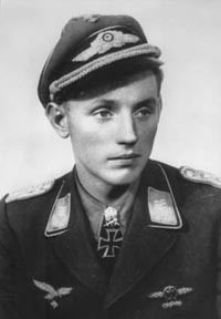 Erich Hartmann looking afar while wearing an Air Force service dress uniform and peaked cap