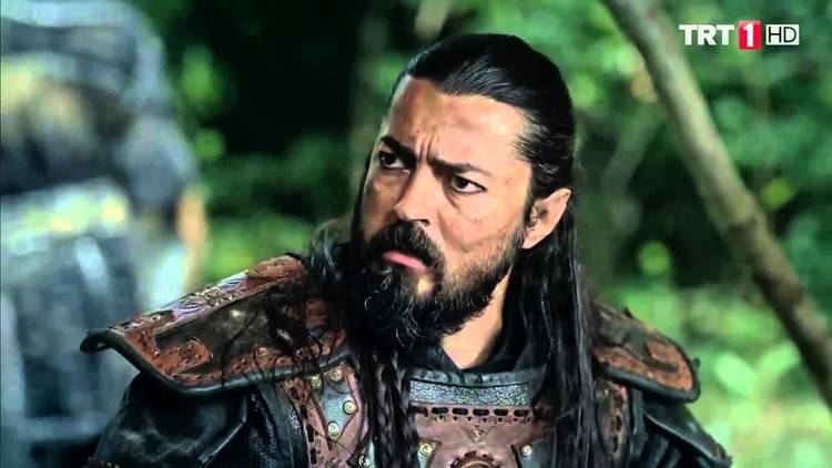 Barış Bağcı as Baiju Noyan with long hair, mustache, and beard.