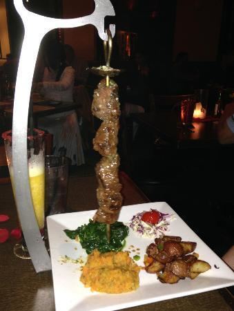 Espetada Espetadaquot marinated beef on hanging skewer Served with potatoes