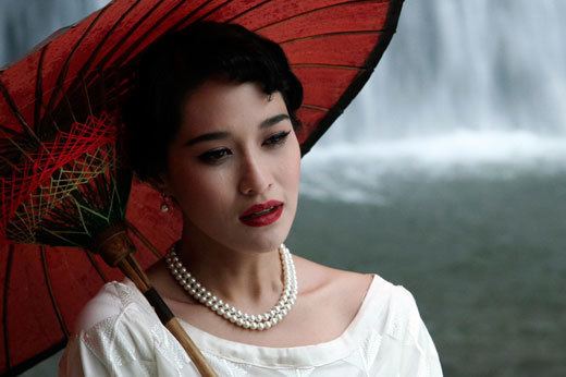 Eternity (2010 Thai film) Starring Tsman Byeonsak holding an umbrella beside the waterfall | movie scene