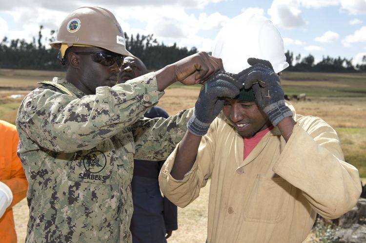 Ethiopian National Defense Force EO2 Orlando Moore left NMCB 1 provides personal protective