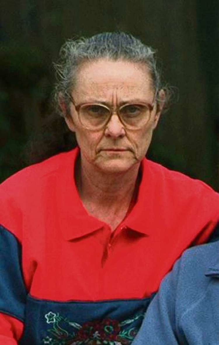 Eunice Spry in a red jacket, wearing an eyeglasses