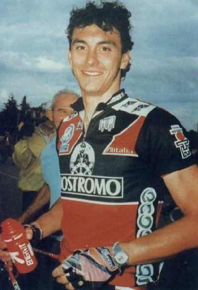 Fabio Casartelli wearing a bike jersey and holding a tumbler