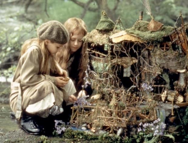 FairyTale: A True Story | Two young girls (Elizabeth Earl and Florence Hoath) sitting beside the fairy house | movie scene