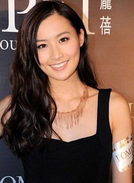 Fala Chen smiling while wearing a black sleeveless top and necklace