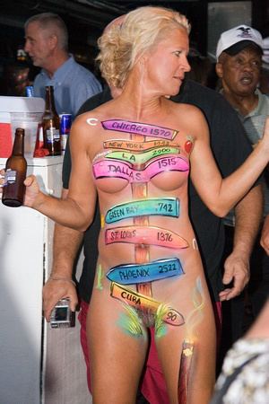A naked woman with her painted body at Fantasy Fest