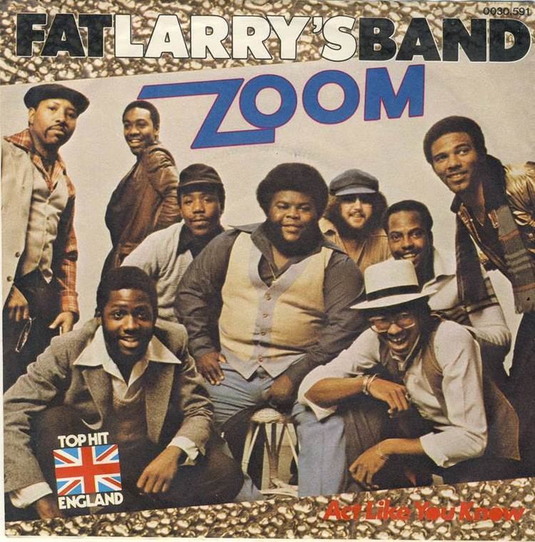 Fat Larry's Band members smiling all together for the single cover of "Zoom"