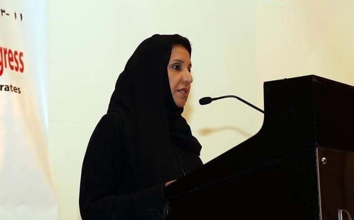 Fatima bint Mubarak Al Ketbi giving speech while wearing a black hijab and black blouse