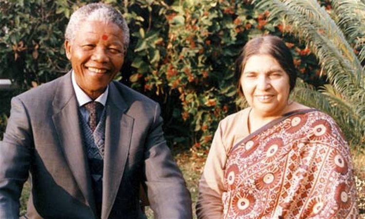 Nelson Mandela smiling together with his comrade, anti-apartheid activist, Fatima Meer.