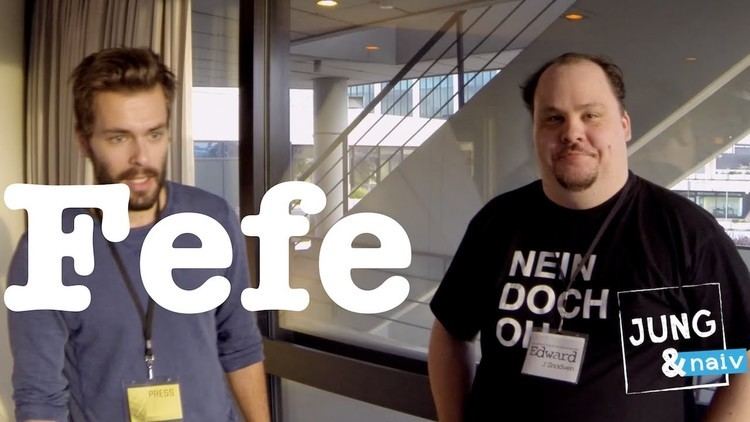 Felix von Leitner smiling and posing with someone and wearing a black shirt.