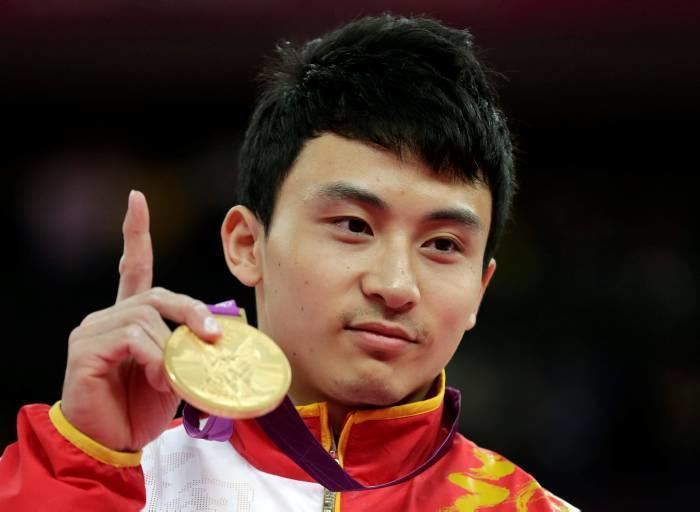 Feng Zhe El gimnasta chino Feng Zhe oro olmpico en barras