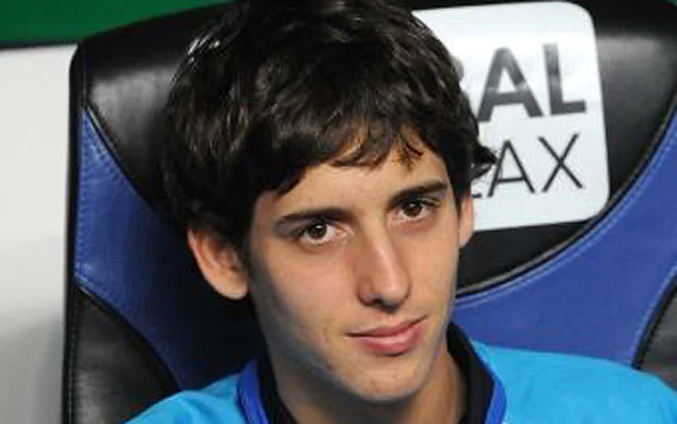 Filippo Mancini smiling while sitting on a black and blue chair