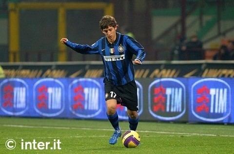 Filippo Mancini playing football while wearing a black and blue uniform