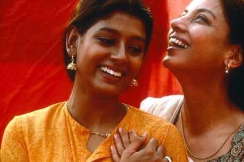 Fire (1996 film) Nandita Das as Sita and Shabana Azmi as Radha laughing at each other | movie scene