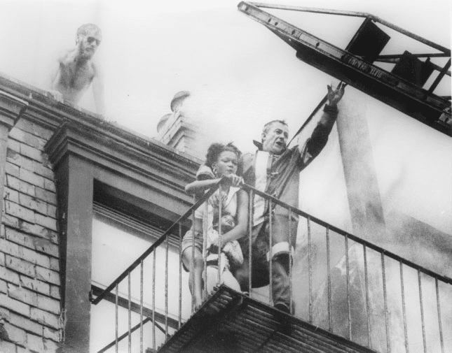 Diana Bryant and Tiare Jones were leaning at the point farthest from the building because of the heat of the fire behind