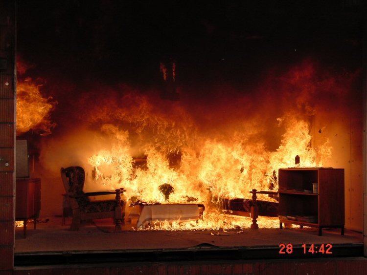 A living room with furnitures on fire caused by flashover